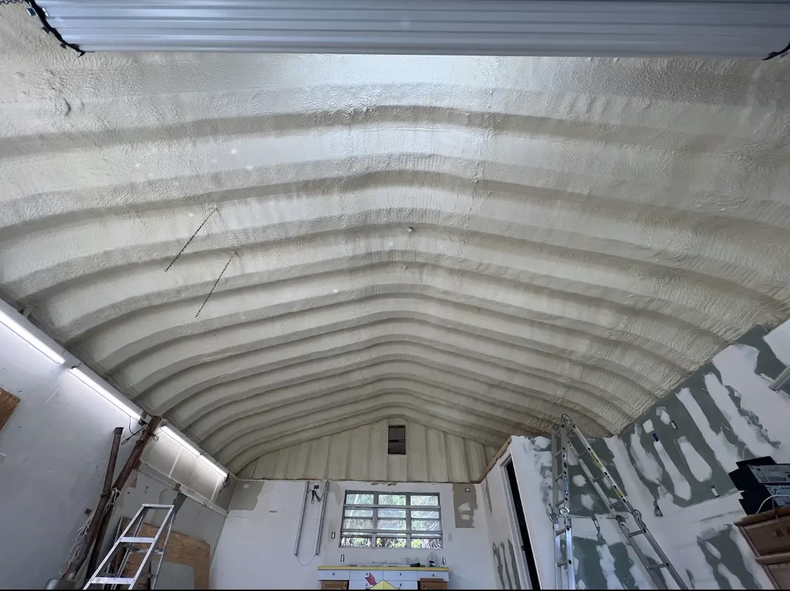 Spray polyurethane foam applied to the underside of a metal roof deck in Chester